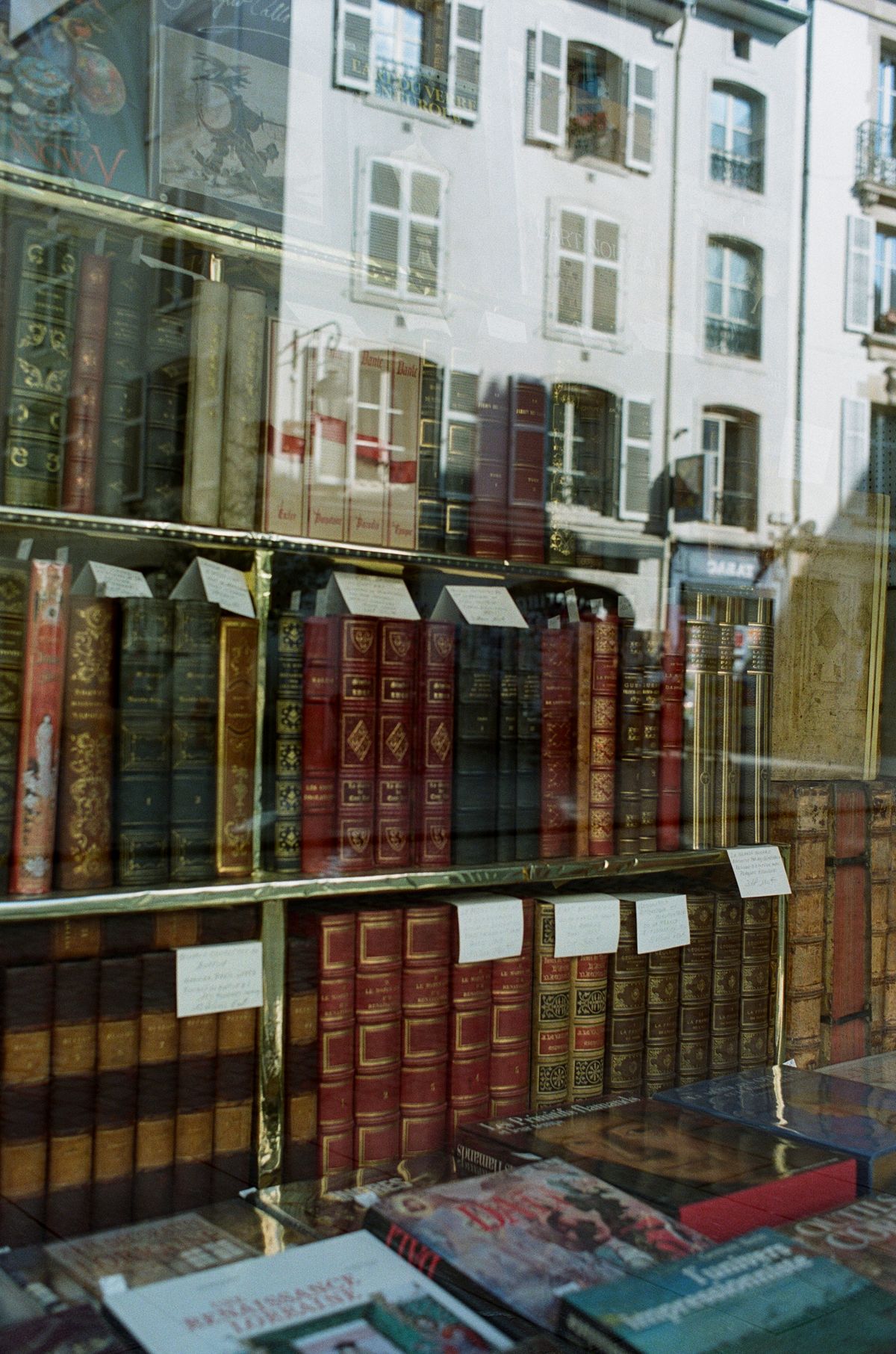 Books with handwritten price tags in an independent bookshop window